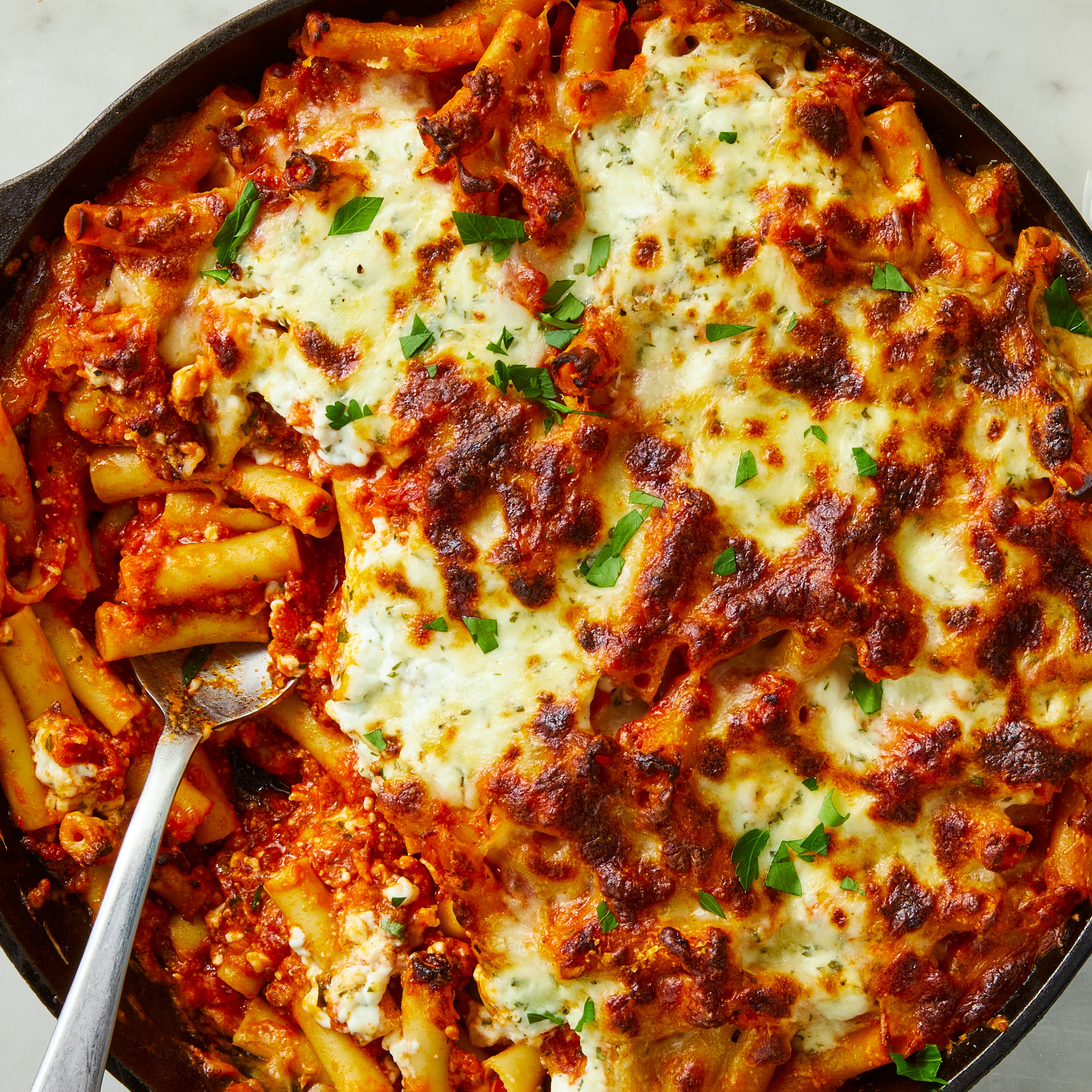 baked ziti with cottage cheese in a skillet