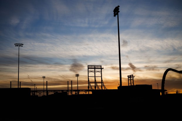 The sun rises before the Cubs first full-squad workout during spring training at Sloan Park on Feb. 16, 2026, in Mesa, Ariz. (Armando L. Sanchez/Chicago Tribune)