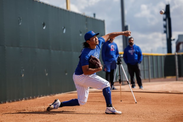 Pitcher Shota Imanaga throws in the bullpen area during spring training at Sloan Park Tuesday Feb. 17, 2026 in Mesa, Ariz. (Armando L. Sanchez/Chicago Tribune)