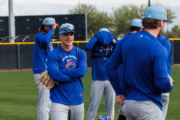 Matt Shaw looks at Nico Hoerner before warmups for a spring training workout at Sloan Park on Feb. 18, 2026, in Mesa, Ariz. (Armando L. Sanchez/Chicago Tribune)