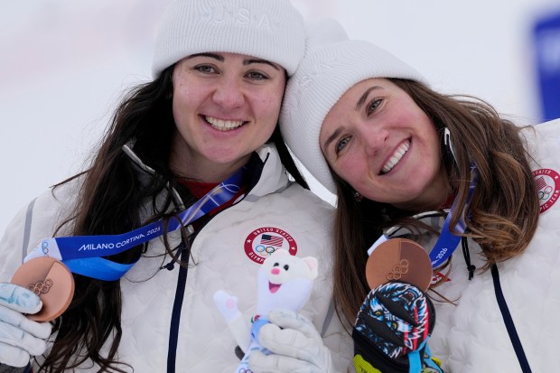 The United States' Jacqueline Wiles, left, and Paula Moltzan show their bronze medals after the women's team combined event at the 2026 Winter Olympics on Tuesday, Feb. 10, 2026, in Cortina d'Ampezzo, Italy. (AP Photo/Andy Wong)