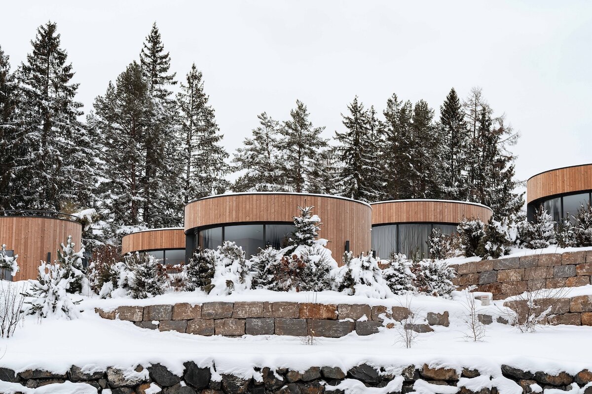 curved cabins show off mountain view at sonnenalp resort