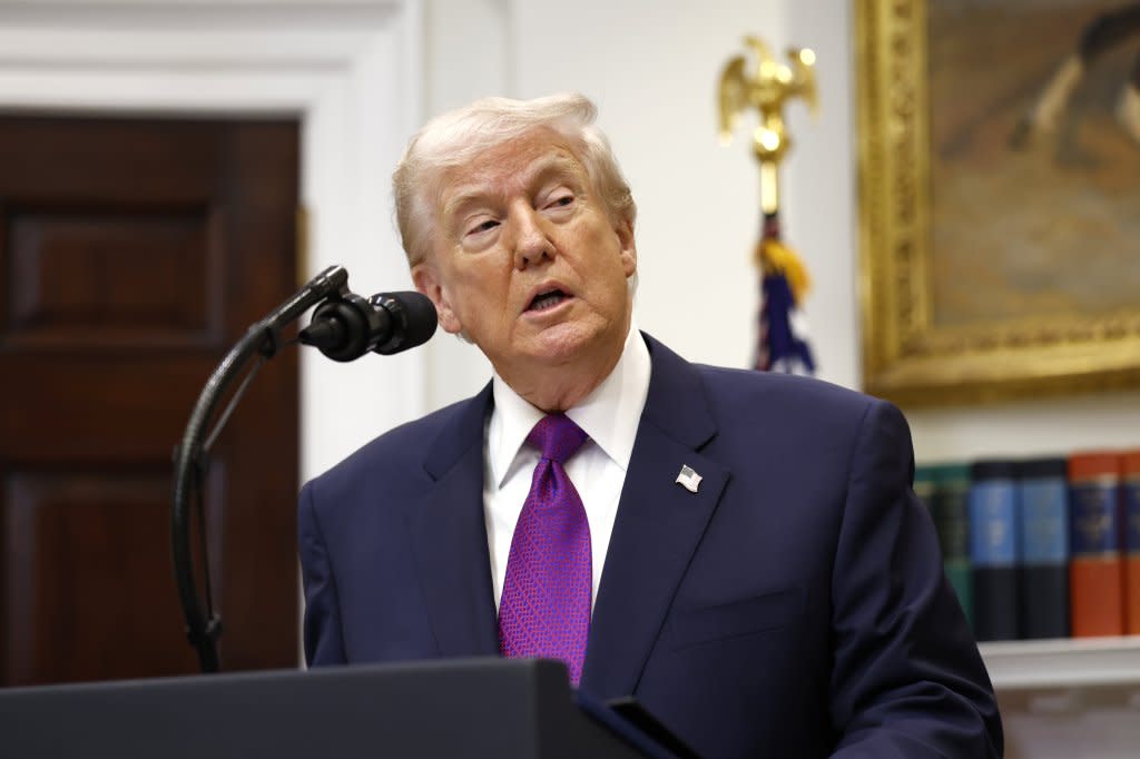 President Donald Trump pardoned five former professional football players on Thursday. Will Oliver – Pool via CNP/Shutterstock