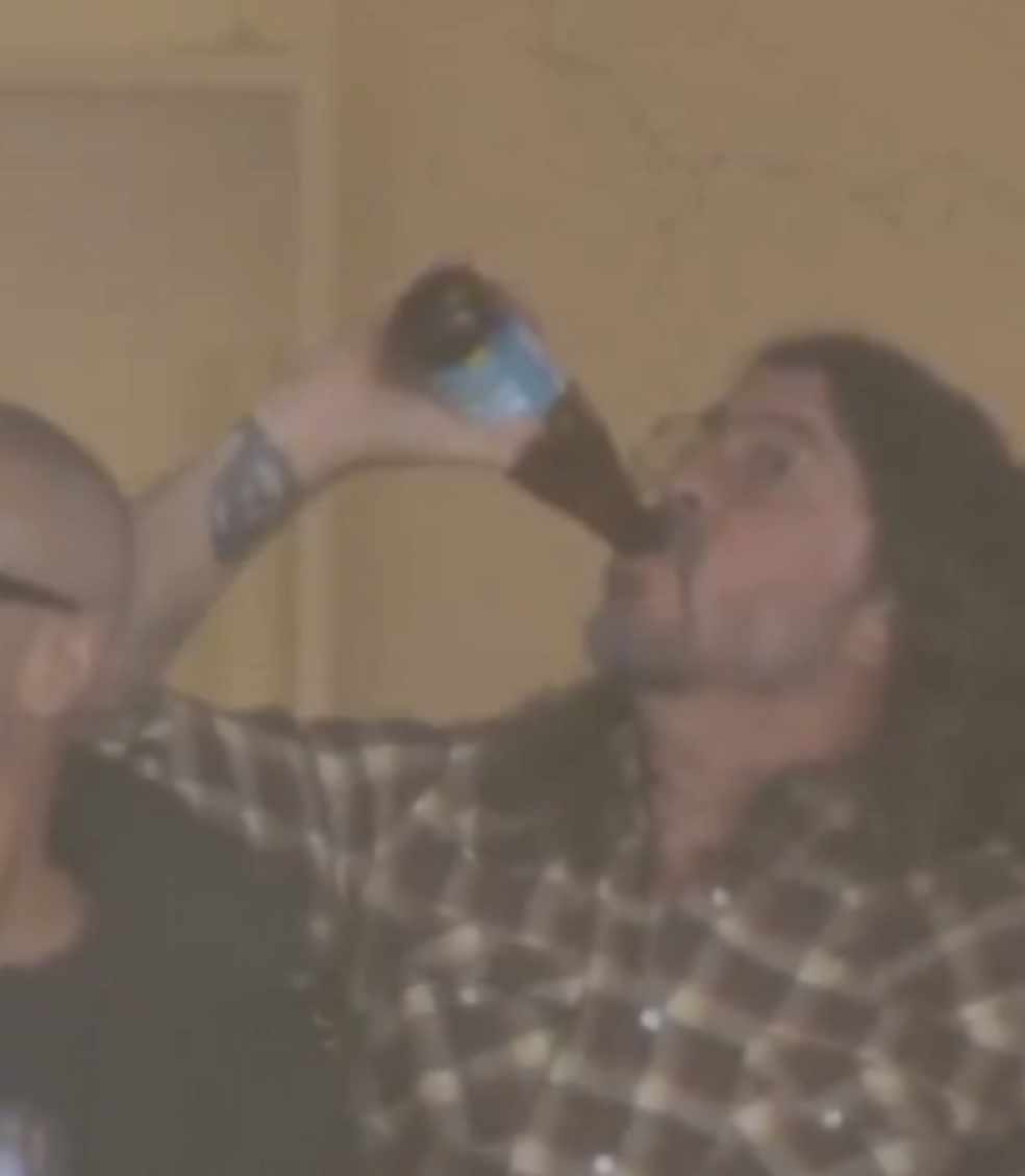 Dave Grohl drinks a beer on the NFL Super Bowl 60 broadcast
