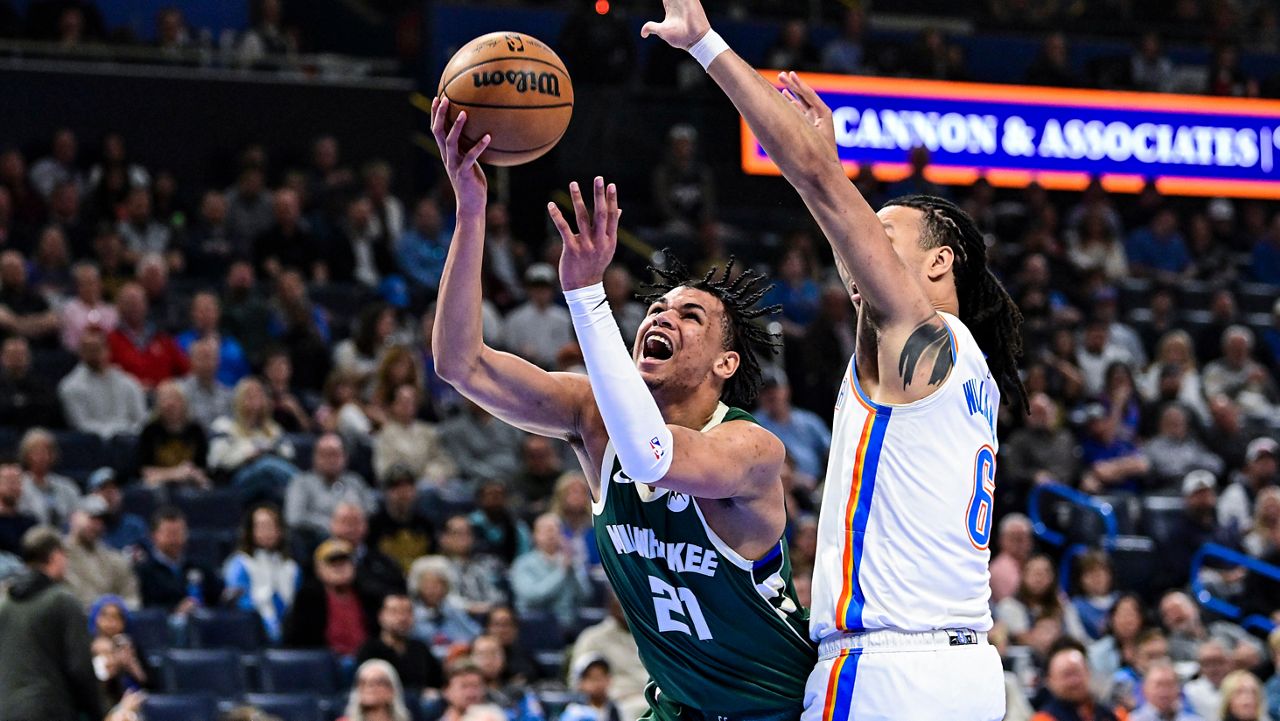 Milwaukee Bucks forward Ousmane Dieng (21) shoots against Oklahoma City Thunder forward Jaylin Williams during the first half of an NBA basketball game Thursday, Feb. 12, 2026, in Oklahoma City.