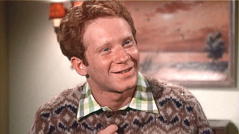 Ralph Malph smiling in sweater