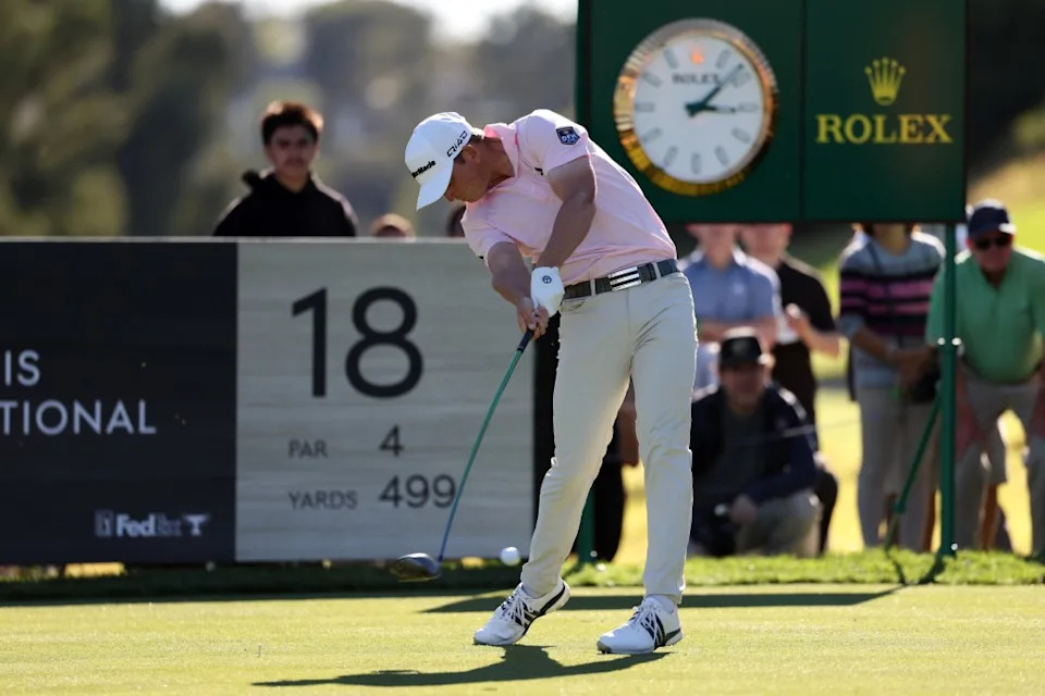 Jacob Bridgeman hits his tee shot on the 18th. Kiyoshi Mio-Imagn Images