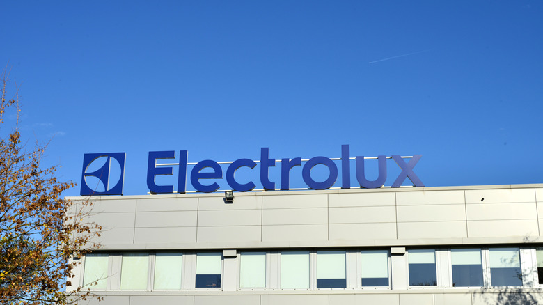 The Electrolux logo and title on top of a manufacturing building