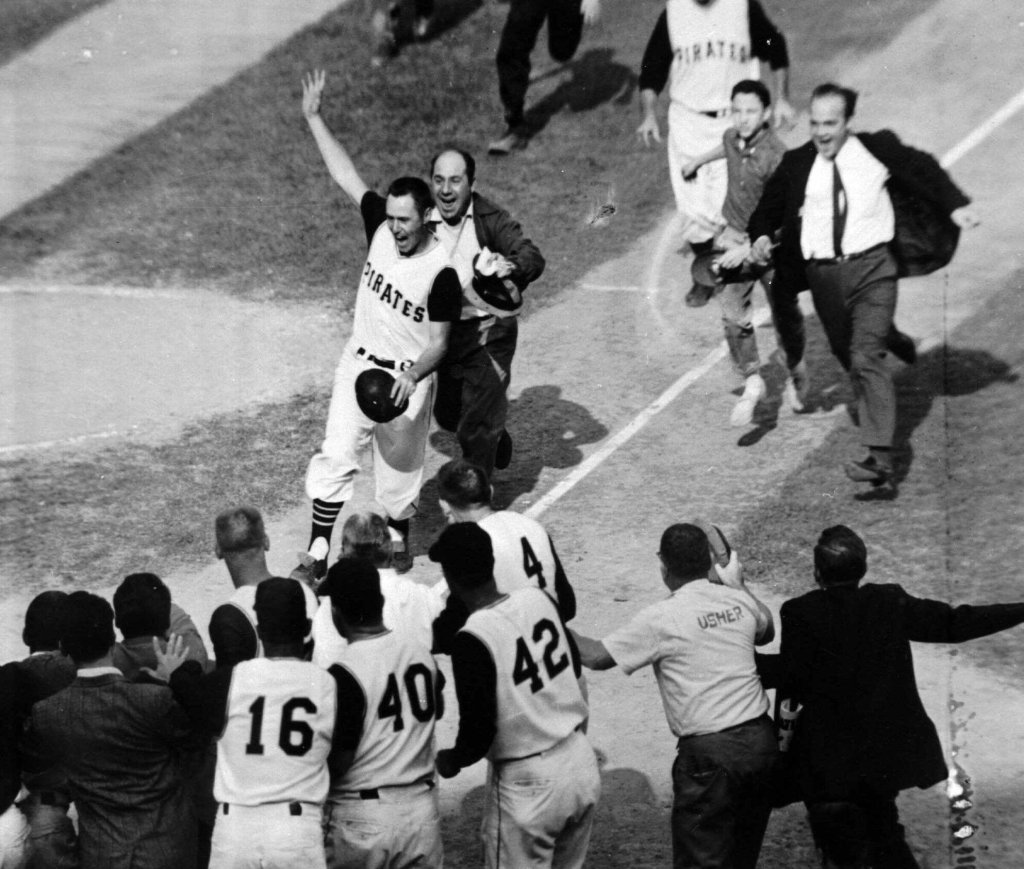 Bill Mazeroski celebrating with teammates after hitting the walk-off home run in the 1960 World Series.