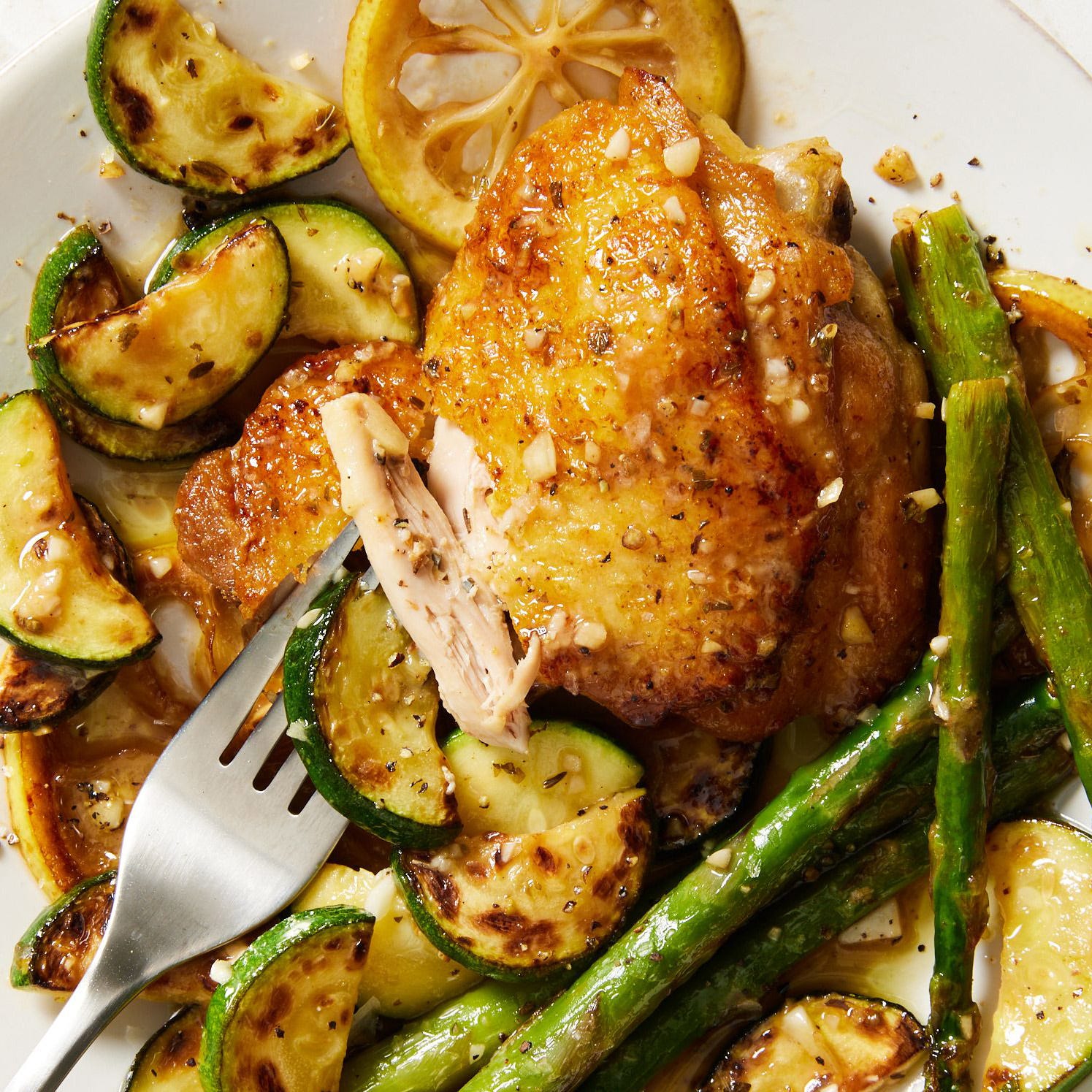 chicken thighs with roasted asparagus, zucchini, and lemons