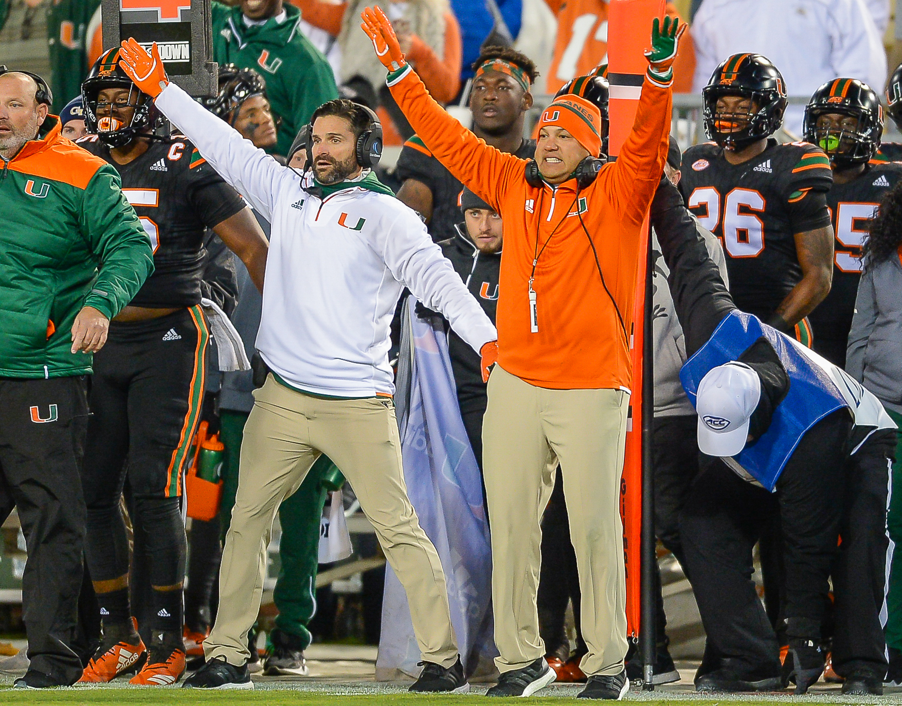 Miami defensive coordinator Manny Diaz (left) and defensive coach Ephraim Banda (right)