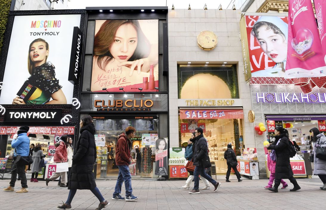 A row of cosmetics stores on the Myeongdong shopping street in Seoul.