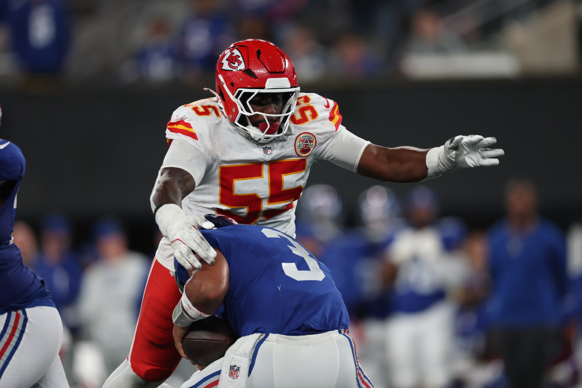 EAST RUTHERFORD, NEW JERSEY - SEPTEMBER 21: Russell Wilson #3 of the New York Giants avoids Omarr Norman-Lott #55 of the Kansas City Chiefs during the fourth quarter at MetLife Stadium on September 21, 2025 in East Rutherford, New Jersey. (Photo by Elsa/Getty Images)