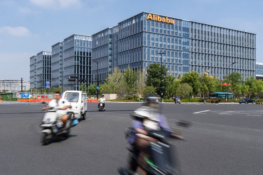 Signage atop a building at the Alibaba Group Holdings Ltd. headquarters in Hangzhou, China, on October 9, 2025.