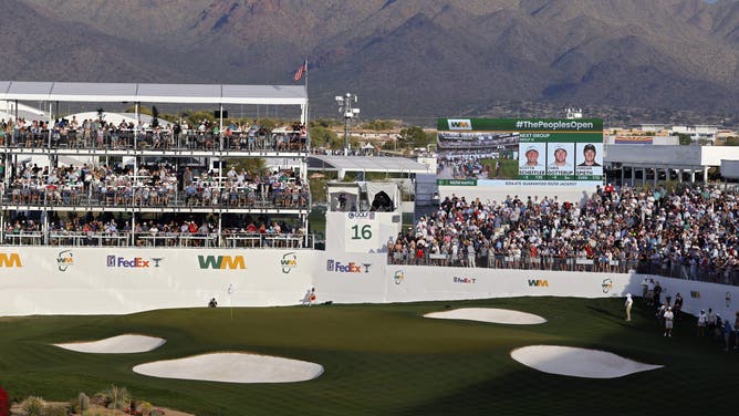 Waste Management Open women in green dress kiss and beer chug
