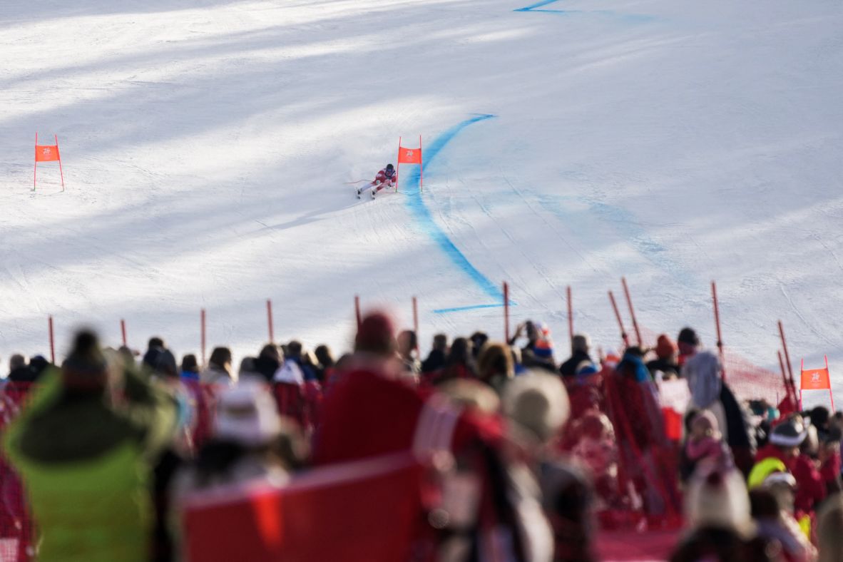 Spectators watch Swiss skier Franjo von Allmen race in the super-G event. <a href=