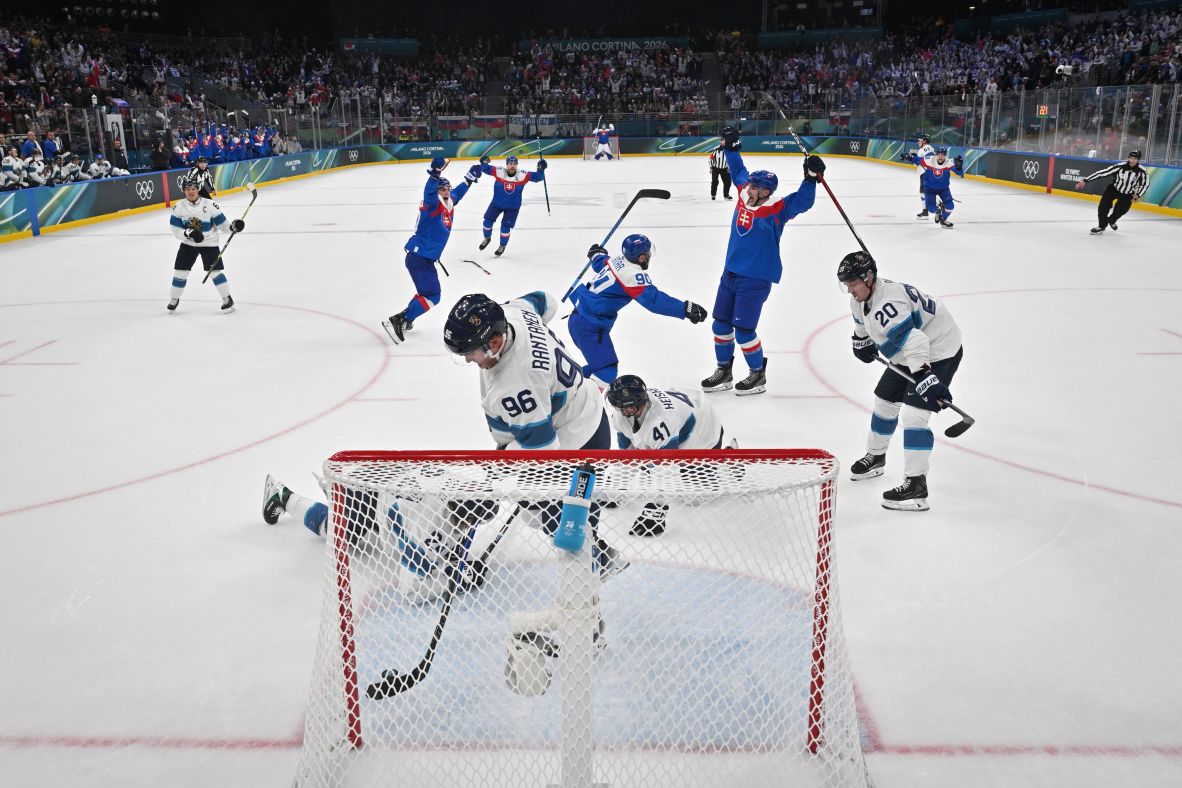 Slovakian hockey players celebrate an empty-net goal at the end of <a href=