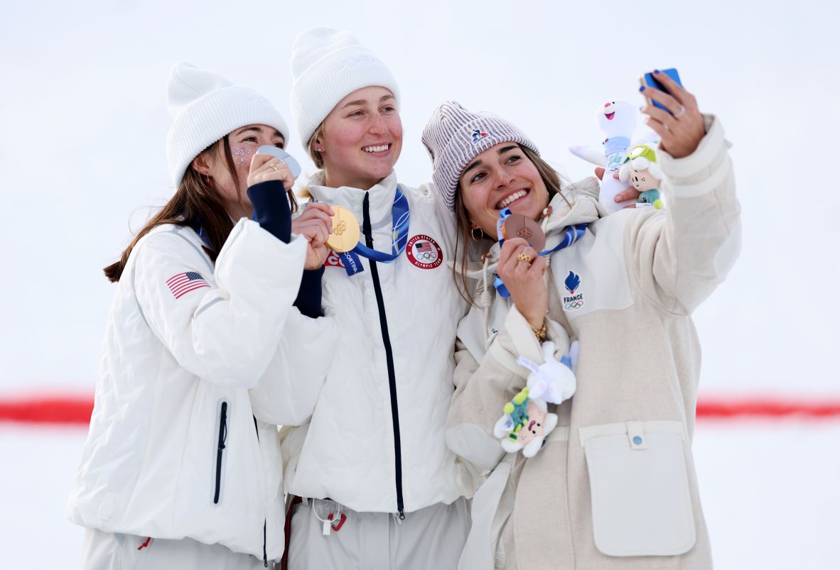From left, the United States' Jaelin Kauf, the United States' Elizabeth Lemley and France's Perrine Laffont take a selfie with their medals on February 11. <a href=