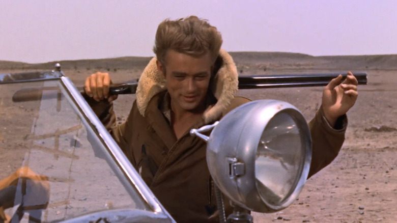 Jett (James Dean) smiling with gun in Giant