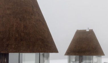 YOD Group crowns glass huts with 10-metre-tall thatched roofs
