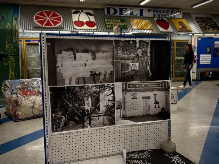 black and white photographs and portraits installed in a 99 cent store