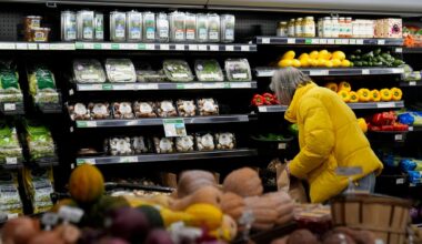 A shopper looks at produce at a grocery store Tuesday, Feb. 10, 2026, in Chicago. (AP Photo/Erin Hooley)