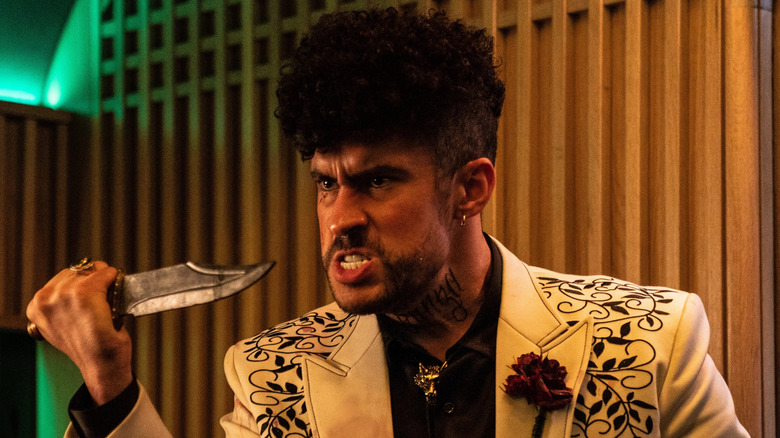 The Wolf (Bad Bunny) holding a knife in Bullet Train
