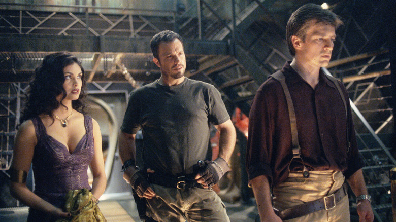 Mal, Inara, and Jayne in the hanger on the Serenity on Firefly (2002-2003)