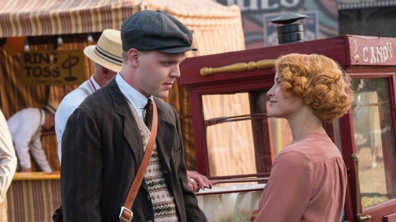 Joe Adler as D. L. Sullivan, speaking to Sarah Jones as Amelia Davenport on Damnation