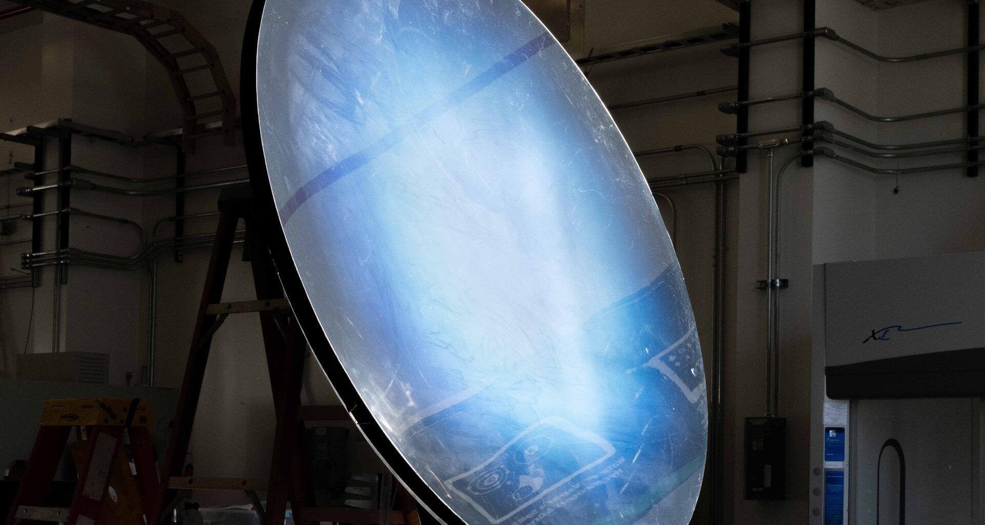 A solar concentrator is tested as part of the Carbothermal Reduction Demonstration (CaRD) project, which aims to produce oxygen from simulated lunar regolith for use at the Moon’s south pole. Credit: NASA/Michael Rushing