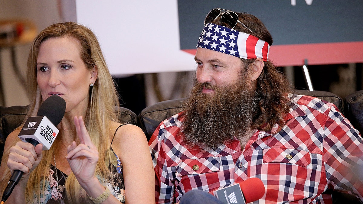 Korie and Willie Robertson speaking on a radio show in 2015