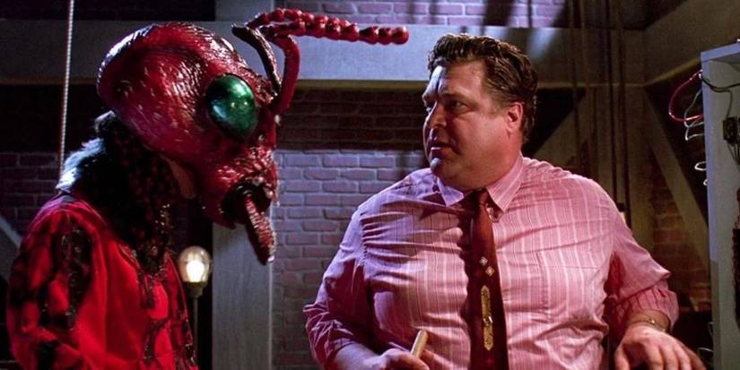 John Goodman as Woolsey talking to man in Mant! costume in Matinee.