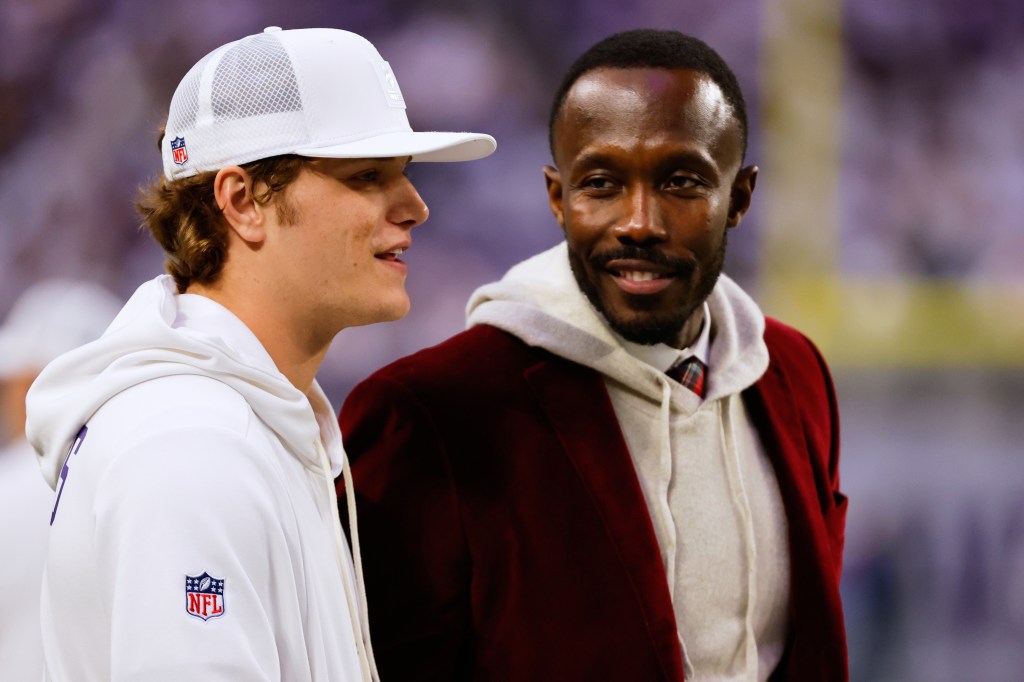 Minnesota Vikings general manager Kwesi Adofo-Mensah, right, speaks with quarterback J.J. McCarthy.