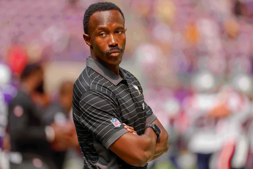 Minnesota Vikings general manager Kwesi Adofo-Mensah with arms crossed.
