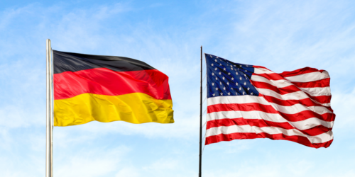 Photo of a german flag (left) and an american flag (right)