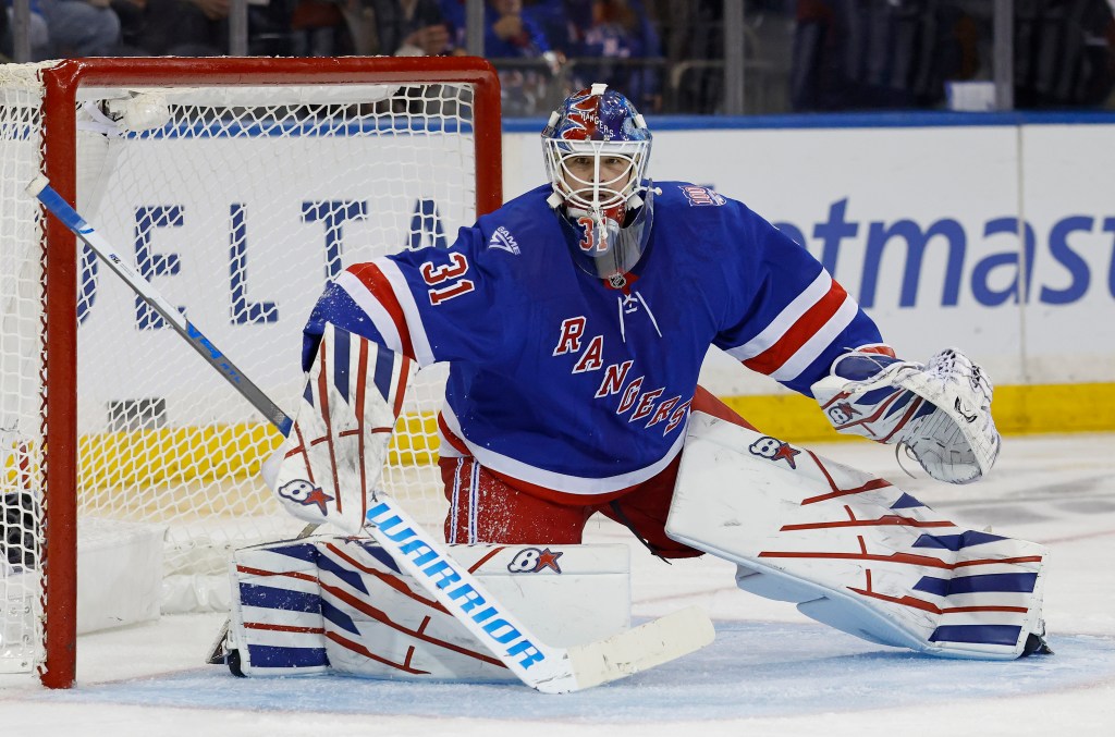 New York Rangers goaltender Igor Shesterkin defends the net.