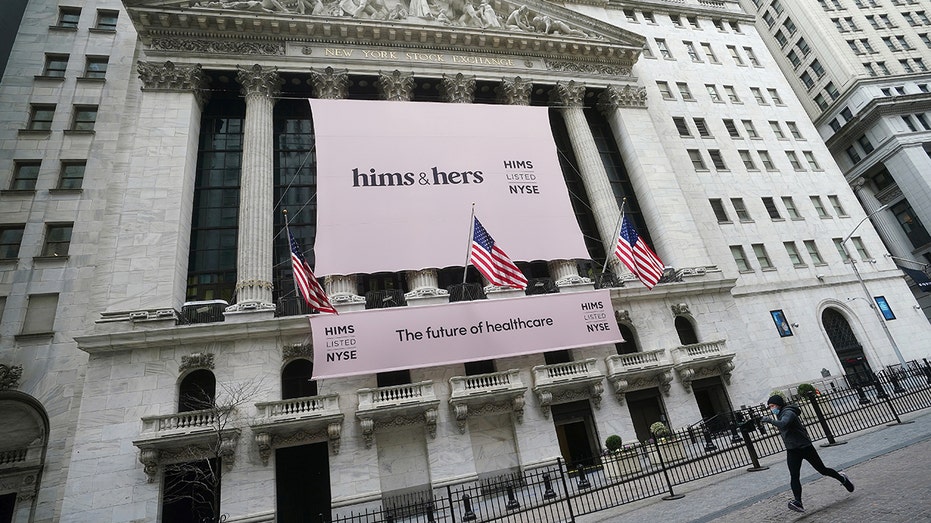The New York Stock Exchange with a Hims and Hers banner on it