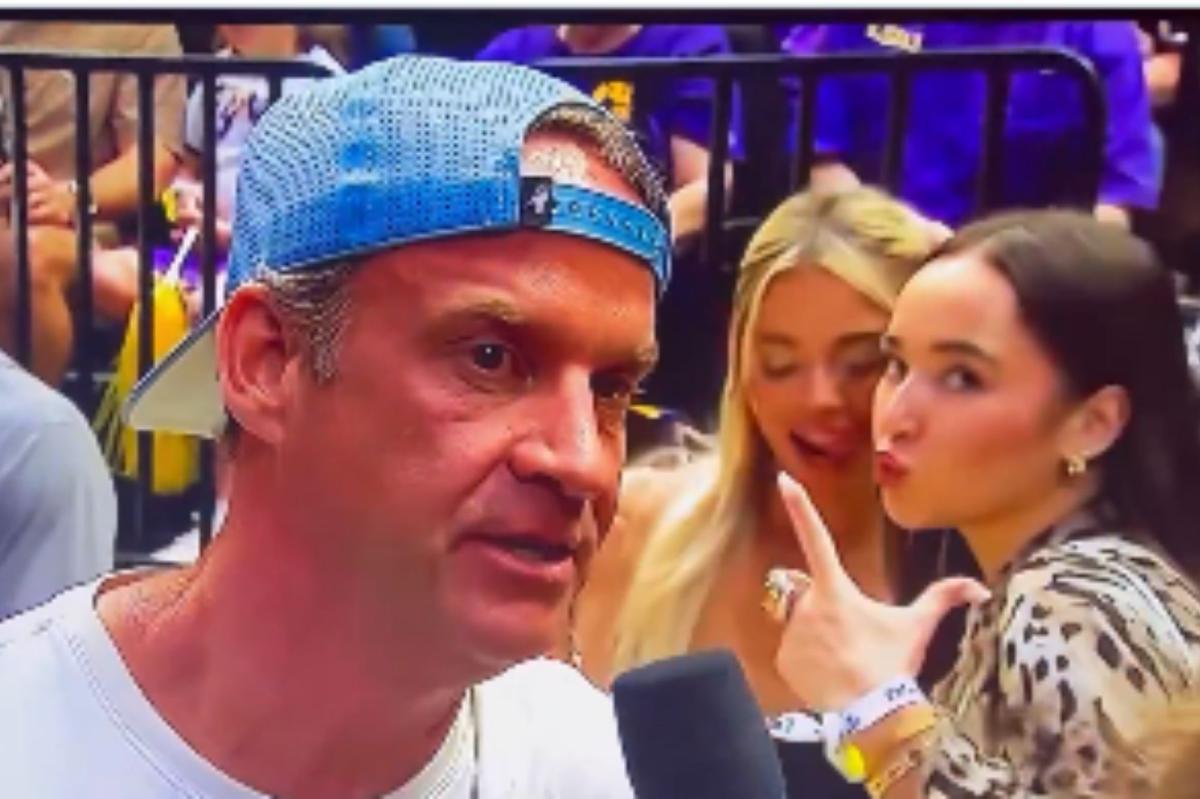 Livvy Dunne photobombs interview with LSU coach Lane Kiffin
