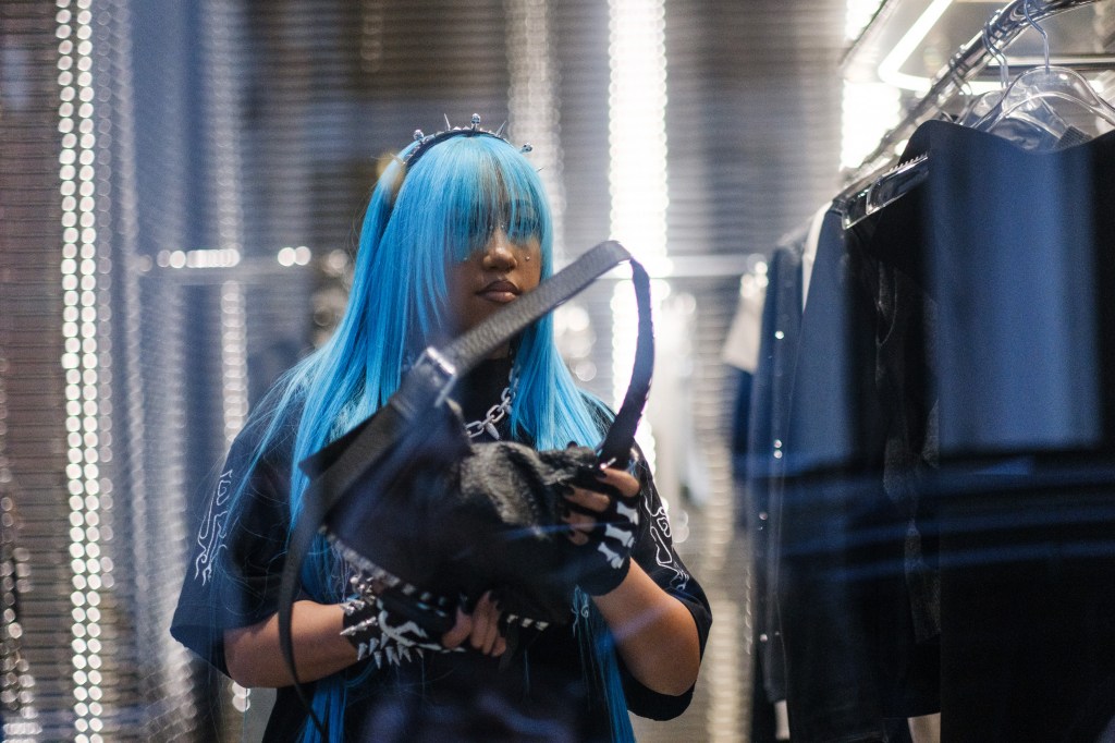 West continued to show off her new facial piercings as she browsed. 