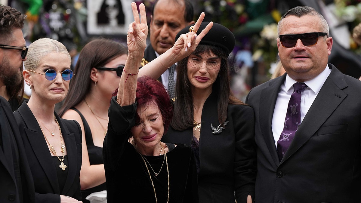 Sharon Osbourne and children crying at Ozzy Osbourne's funeral.