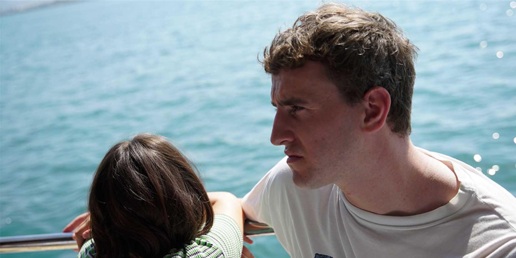 Paul Mescal as the father on a boat with his daughter in Aftersun, 2022.