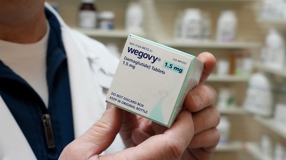 Pharmacist holding a box of 1.5mg Wegovy tablets