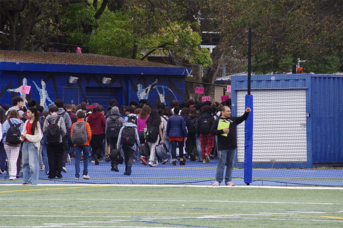 Students evacuate to the football field while following their teachers' instructions. They stayed on the field for about 15 minutes to ensure their safety before returning to class. 