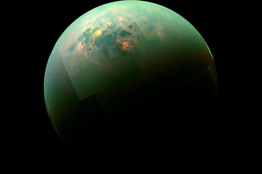 A view of Titan from Cassini, with the sun illuminating  the moon's north polar seas.
