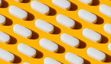 White pills in a yellow background