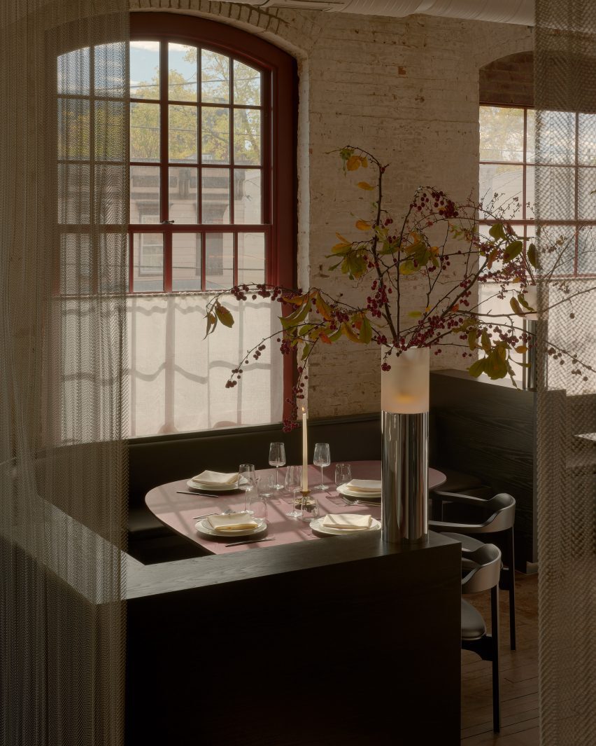 Chainmail curtains in front of a dining booth