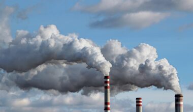 Emissions pour from smokestacks at an industrial plant.