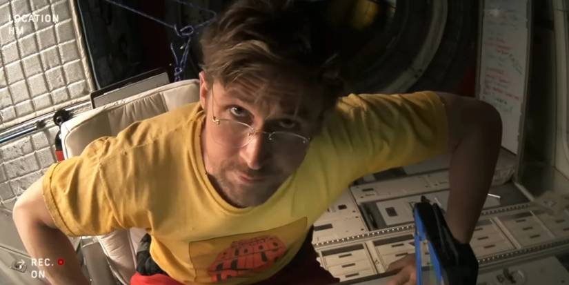 Ryalnd Grace (Ryan Gosling) leans into his console aboard a spaceship facing the camera in Project Hail Mary