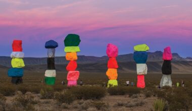 a collection of colorful stone totems by ugo rondinone