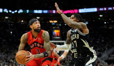 Toronto Raptors' Brandon Ingram looks to shoot against Milwaukee Bucks' Kevin Porter Jr. during the first half of an NBA basketball game Sunday, Feb. 22, 2026, in Milwaukee. (AP Photo/Aaron Gash)